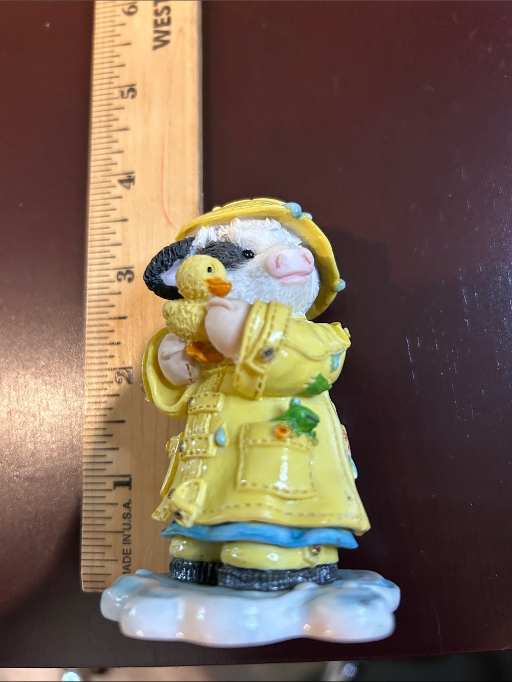 Mary Moos  cow Figurine in Yellow Raincoat Holding Duck